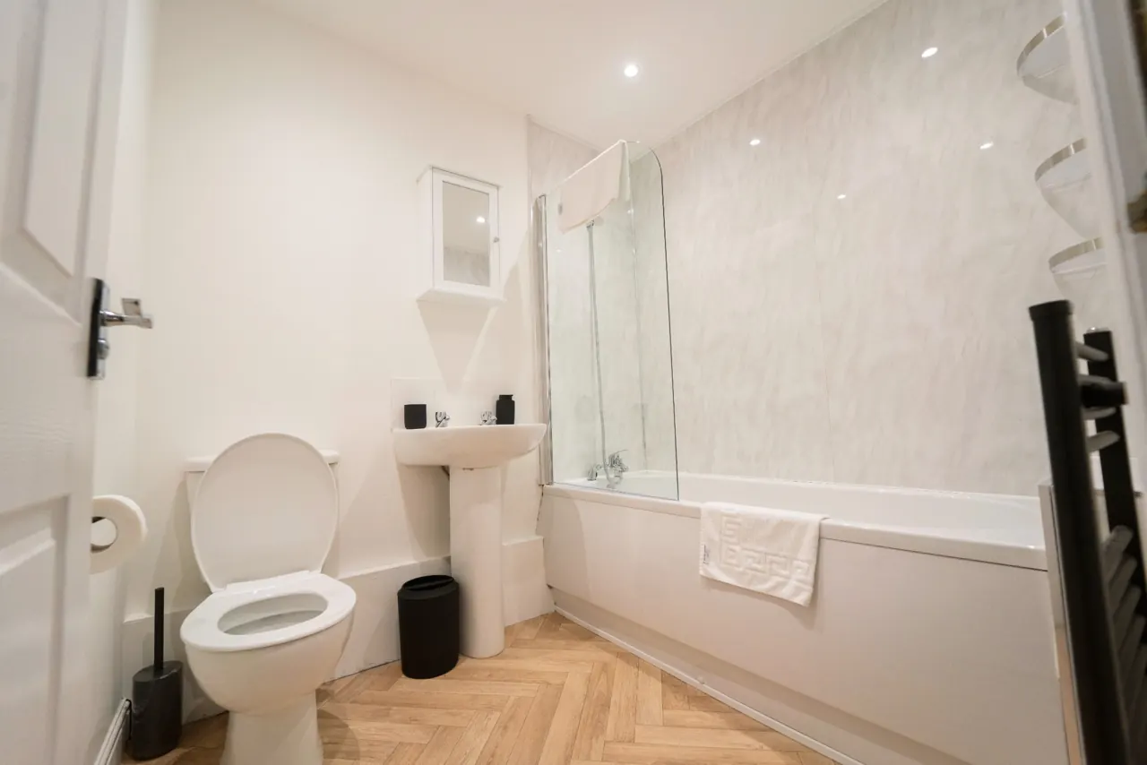 Bathroom with bath and shower