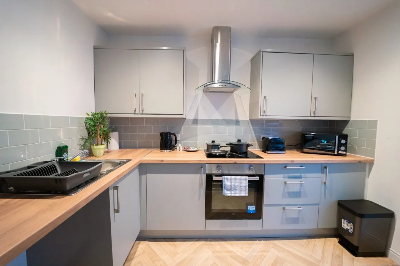 Fitted kitchen with oven and hob